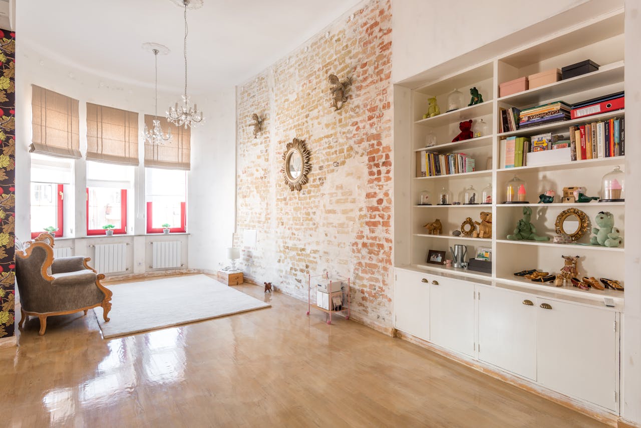 Spacious and bright loft with exposed brick, elegant decor, and modern furnishings.